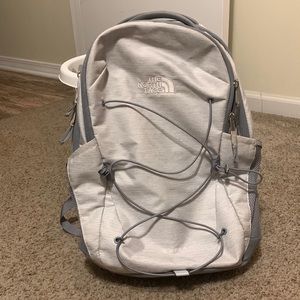 White and medium grey North Face backpack w/ computer pocket